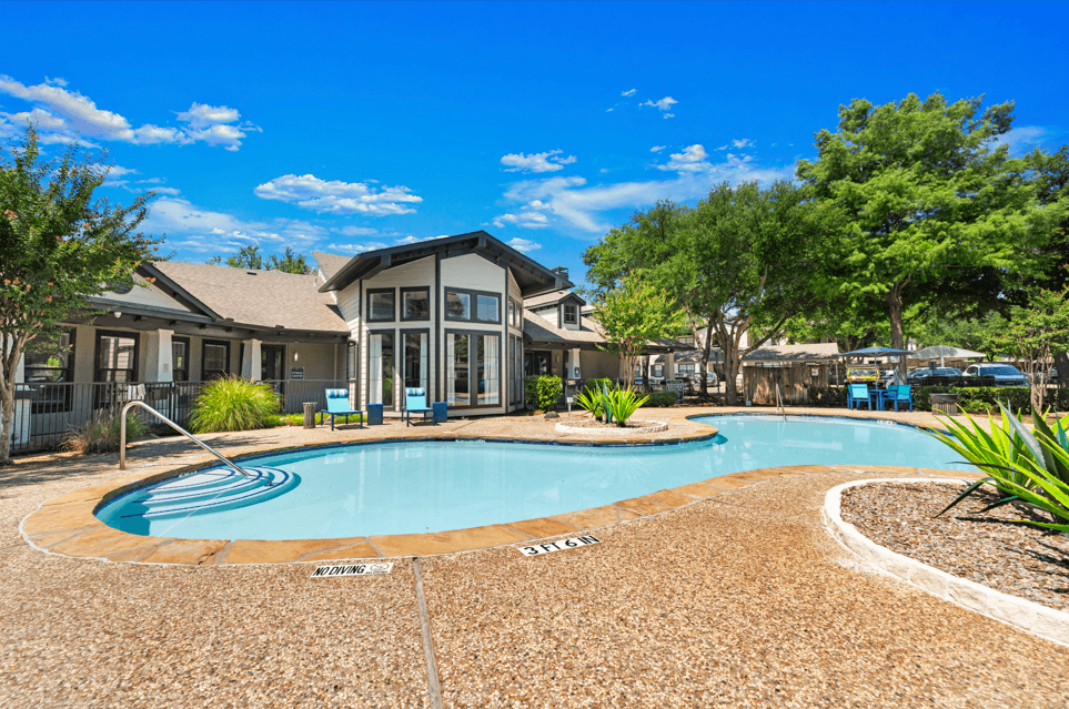 A large house with a pool in the backyard.