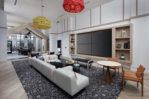 a rendering of a living room with white furniture and a large screen tv on the wall