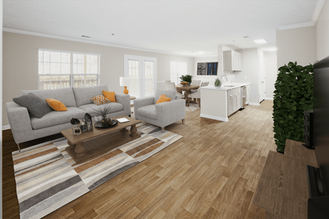 A living room with a grey couch and a wooden coffee table.