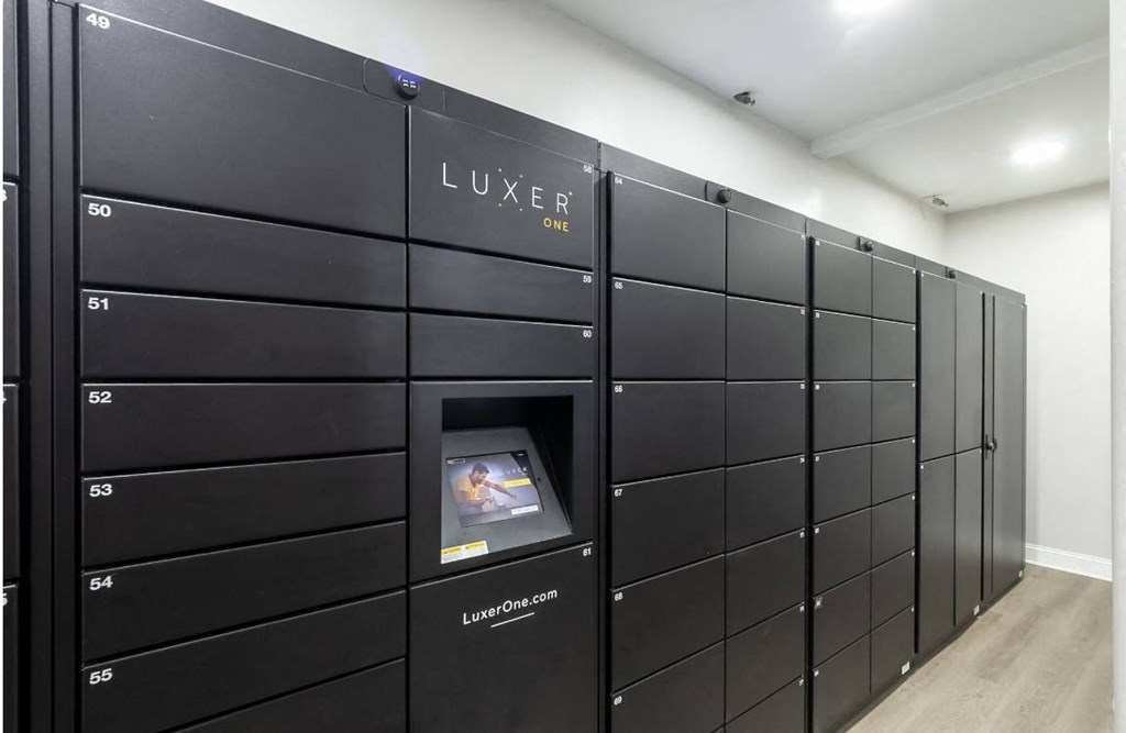 a bunch of lockers in a room with an oven in it
