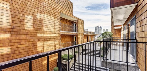 a balcony with a view of the city
