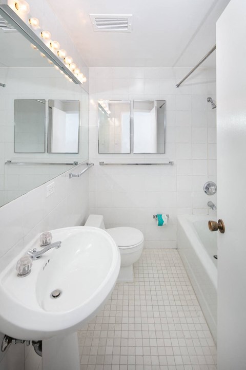 a bathroom with a sink toilet and bathtub