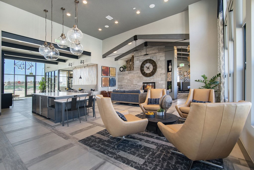 a living room with couches and chairs and a table