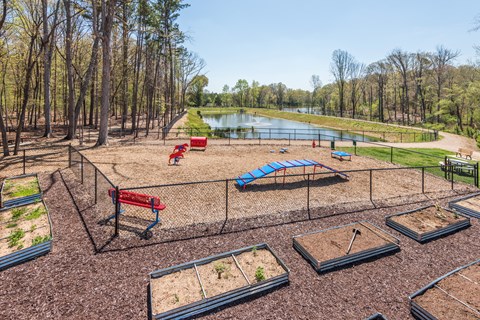 A playground with a slide, swings, and sandboxes.