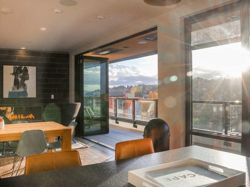 A modern dining room with a view of the mountains outside.at Axle, Washington, 98119