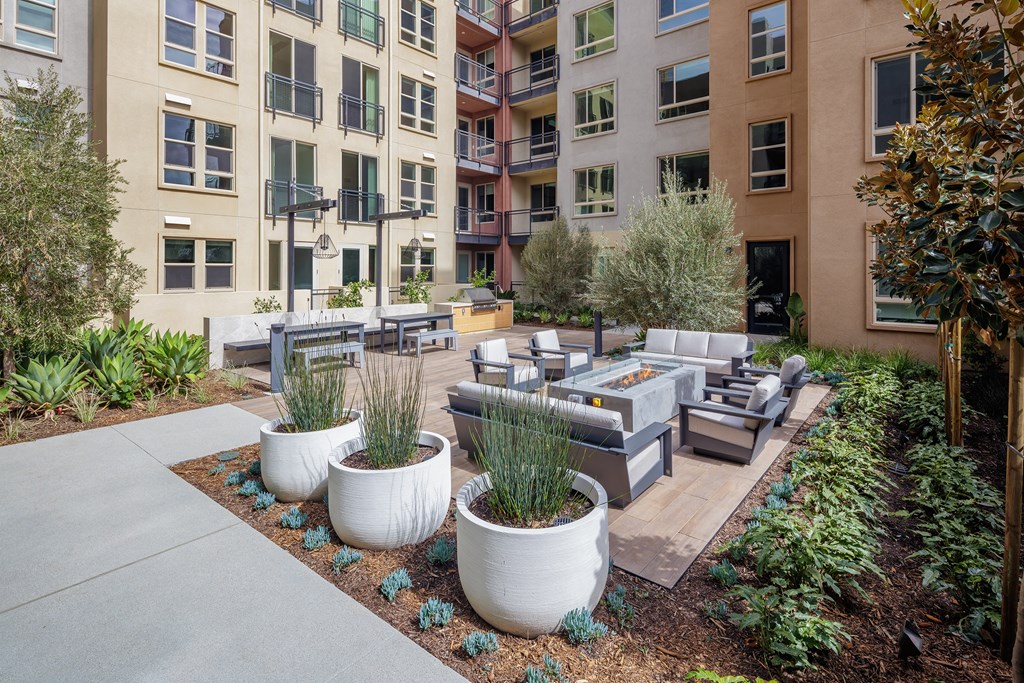 an outdoor lounge area at the bradley braddock road station apartments