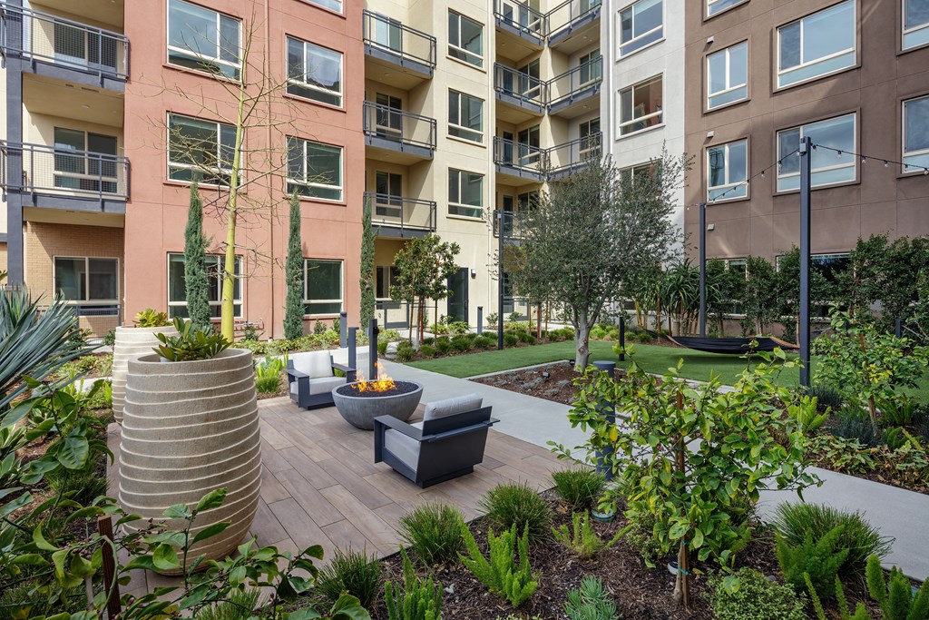 an outdoor lounge area at the bradley braddock road station apartments