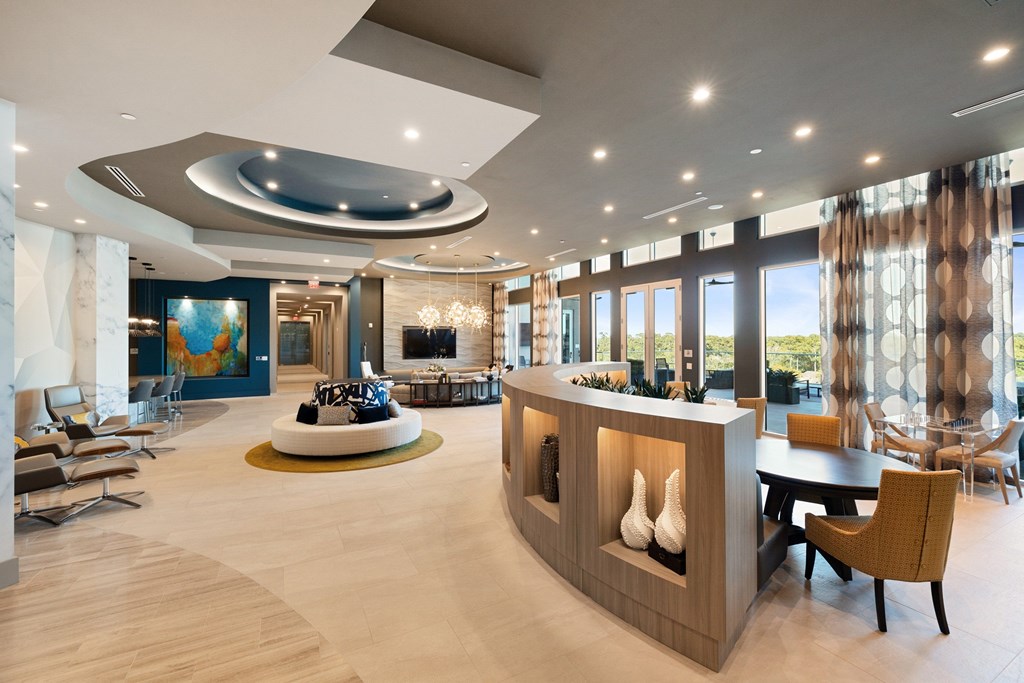 A modern living room with a curved ceiling and a fireplace.