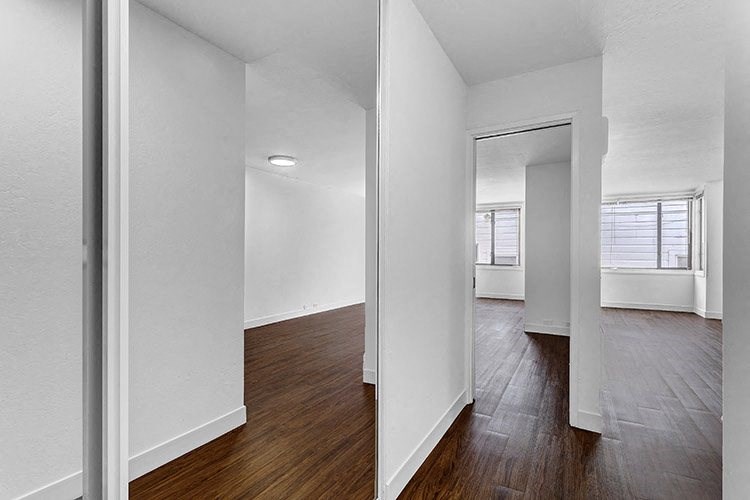 a view of the living room and dining room from the kitchen