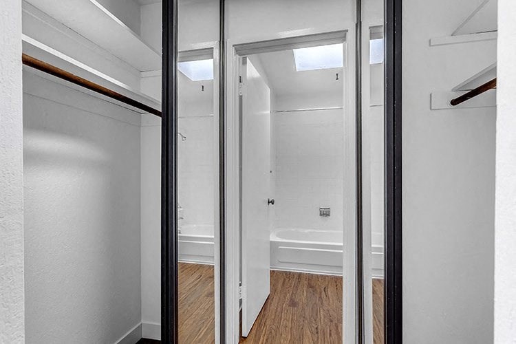 a bathroom with a toilet and a bathtub