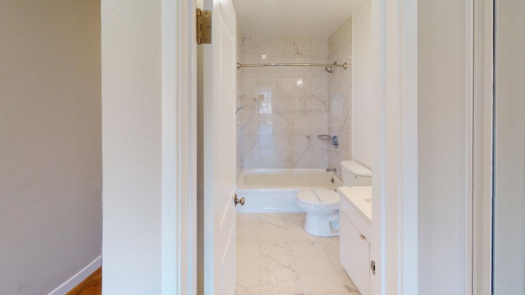 a bathroom with a toilet sink and bathtub