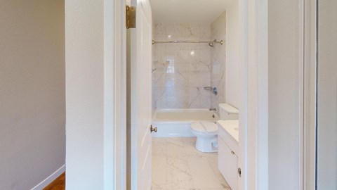 a bathroom with a toilet sink and bathtub