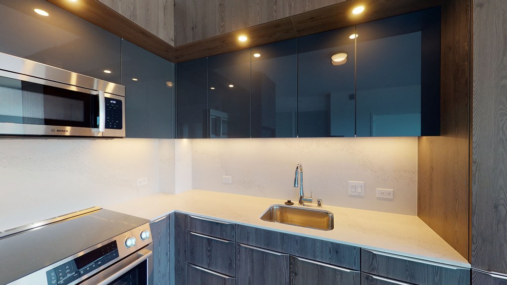 a kitchen with a sink and a stove