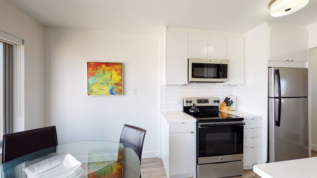 a kitchen and dining area in a 555 waverly unit