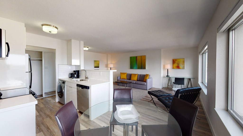 a kitchen and living room in a 555 waverly unit