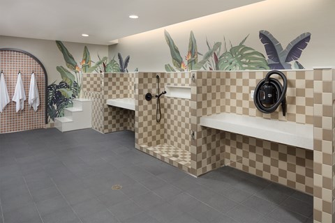 A bathroom with a checkered tile design on the walls and floor.