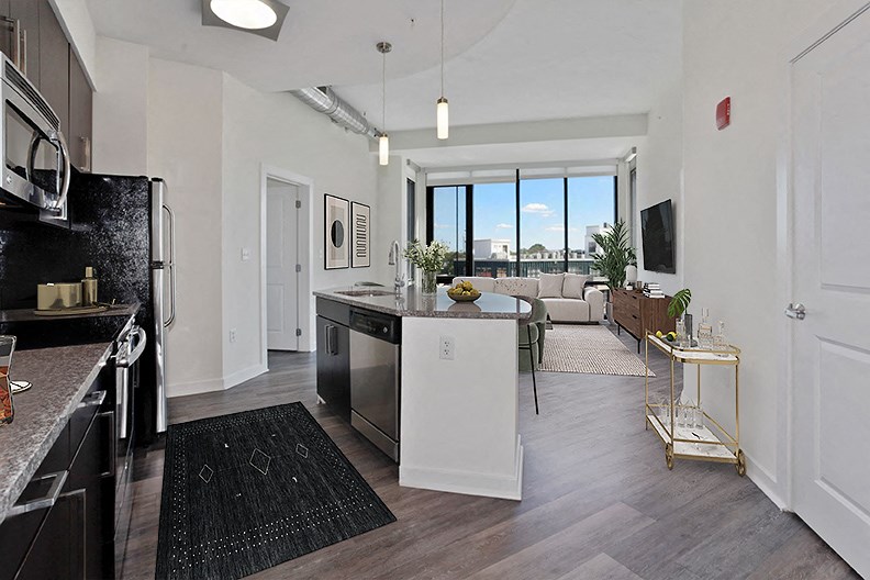 an open floor plan with a kitchen and living room