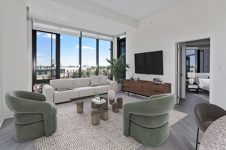 a living room with a couch and chairs and a television