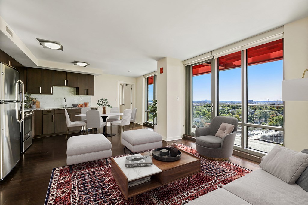 a living room with a view of a kitchen and living room
