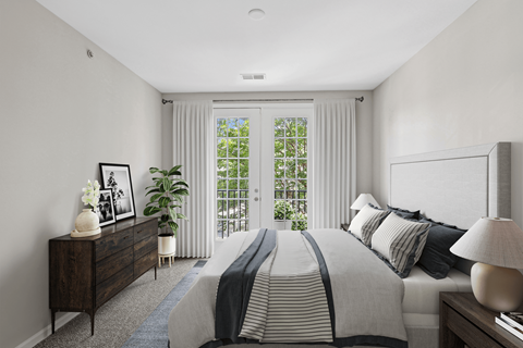 a bedroom with a large bed and a large window