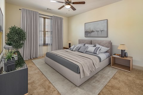 a bedroom with a bed and a ceiling fan