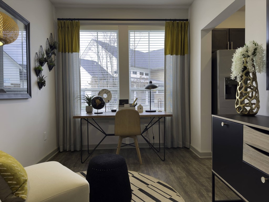 Small Desk Facing Window with White Curtains