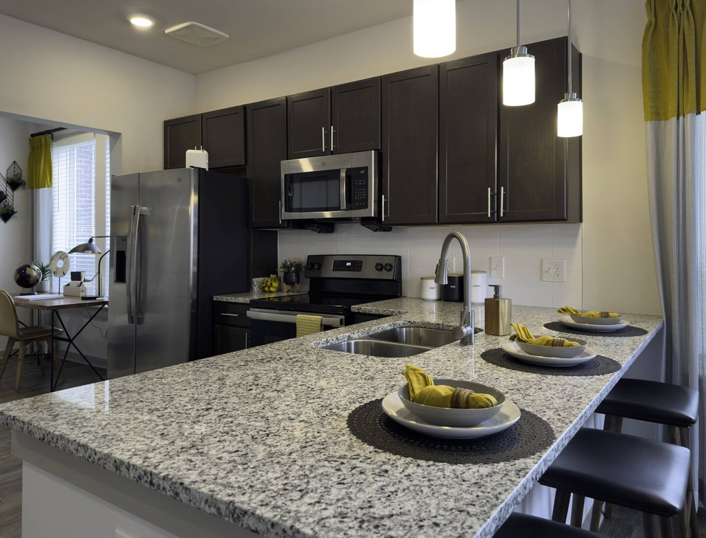 3 Place Settings on Granite Countertop of Kitchen Island