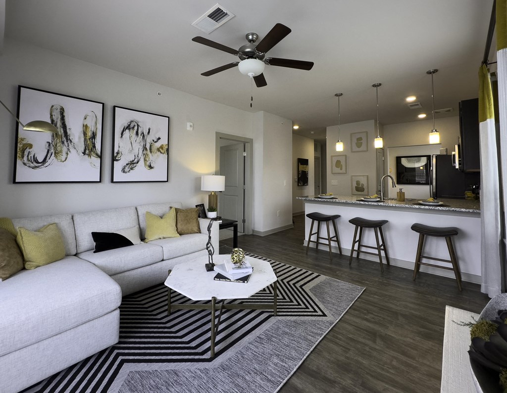 Apartment Living Room with White Sectional and Table