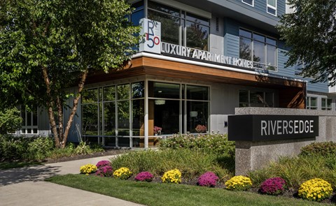 The front of a building with a sign that says Riversedge.