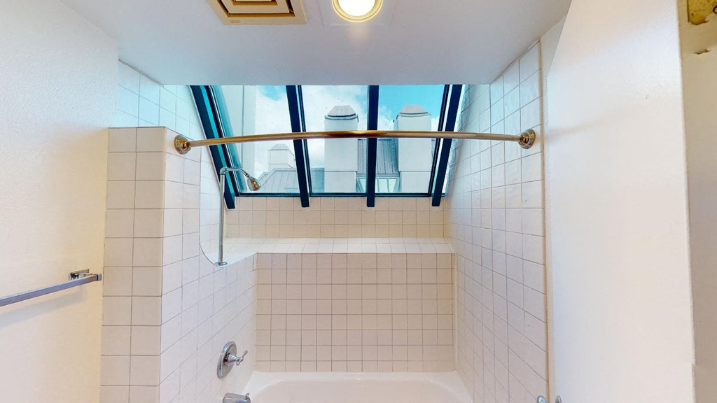 a bathroom with a shower and a tub