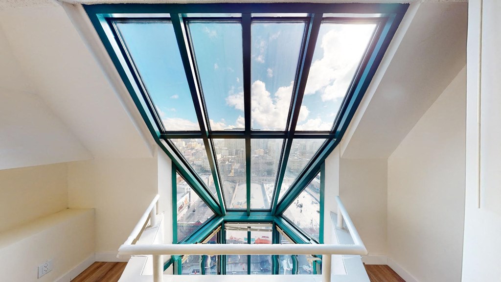 a large skylight fills the top floor of this home with natural light