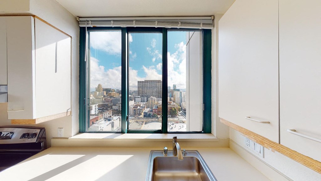 a kitchen with a large window and a sink