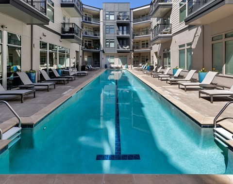A long rectangular pool with a blue tiled border.