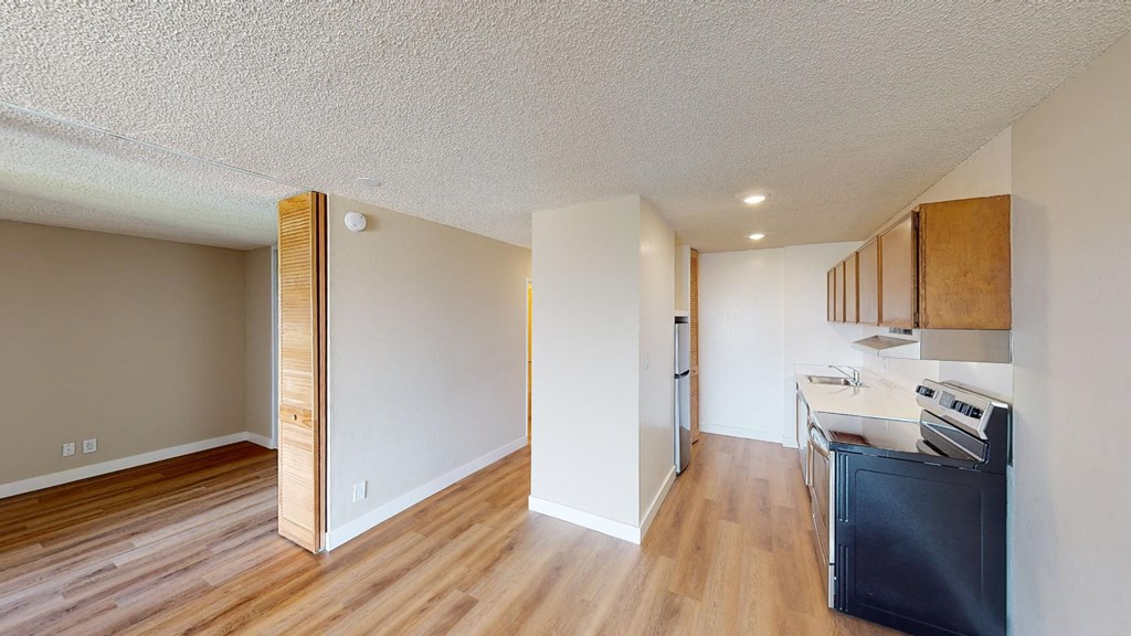 a kitchen and dining area in a 555 waverly unit