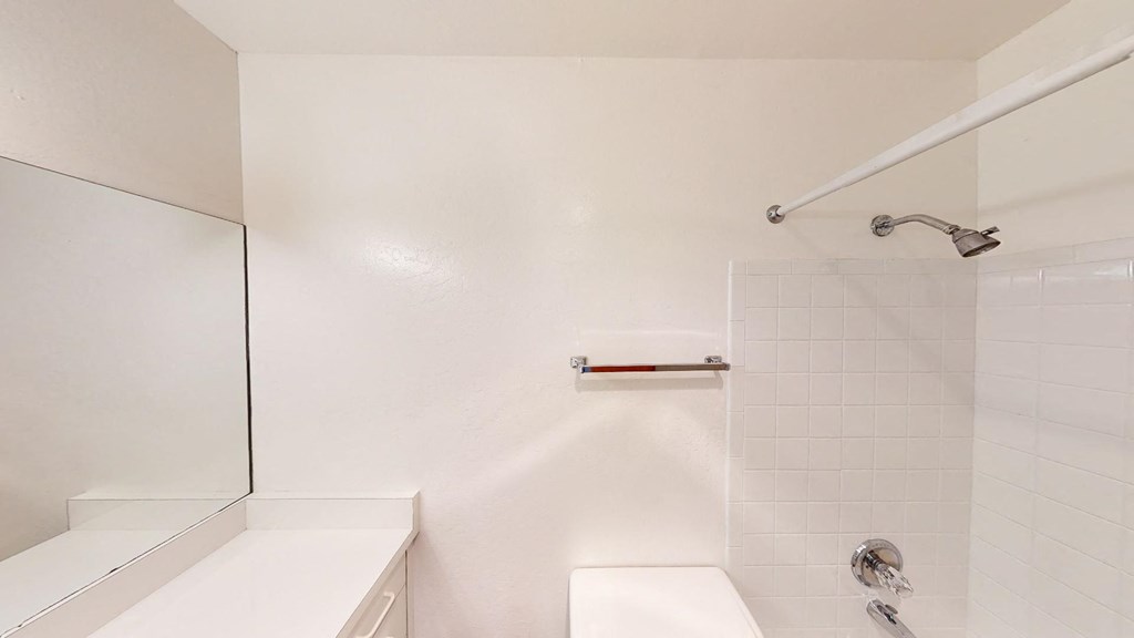 a bathroom with a shower and a sink