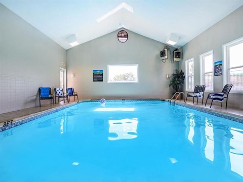 A large indoor swimming pool with the number 5 on the water.