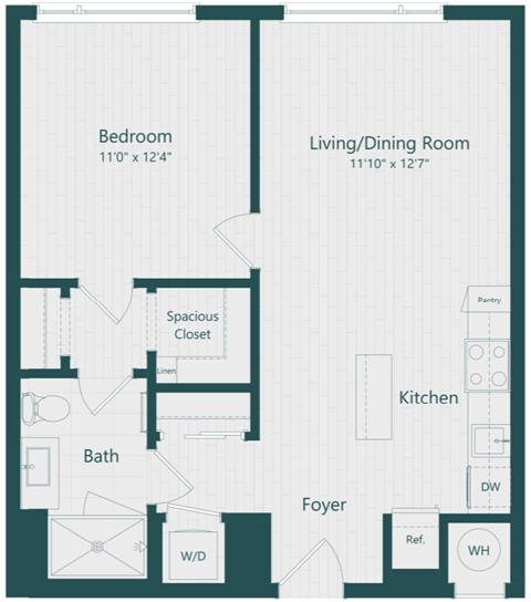 A floor plan of a small apartment with a bedroom, living/dining room, kitchen, bath, foyer, and laundry area.