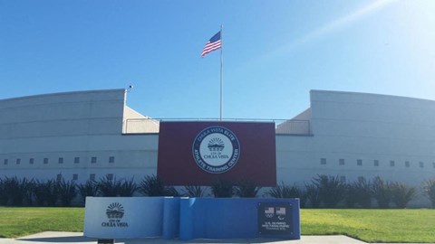 a flag on top of a building with an flag