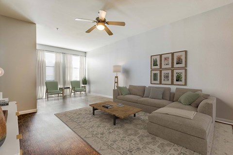 A living room with a grey couch and a coffee table.