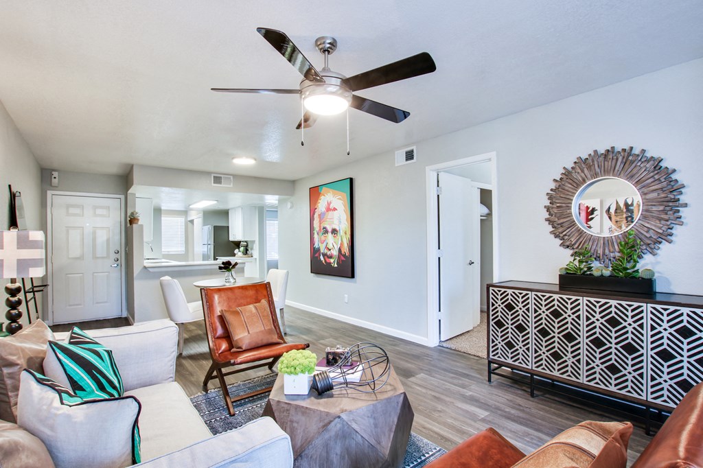 a living room with a ceiling fan and hardwood floorsat The Julia, Mesa, 85210