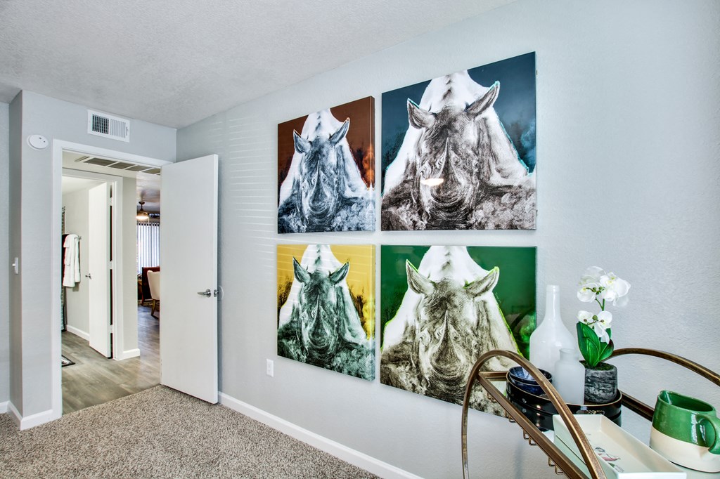 a wall with four pictures of a horse on itat The Julia, Mesa Arizona