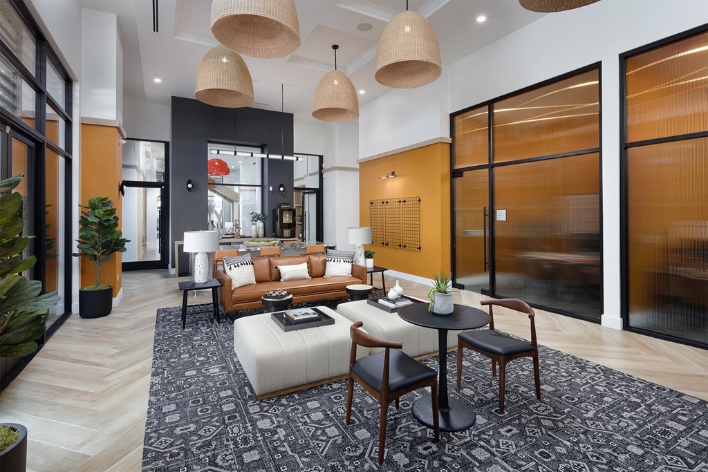 a living room filled with furniture and a large window