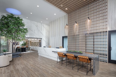 A modern dining area with a long table and chairs.