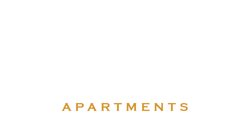 the apartments logo in gold against a white background