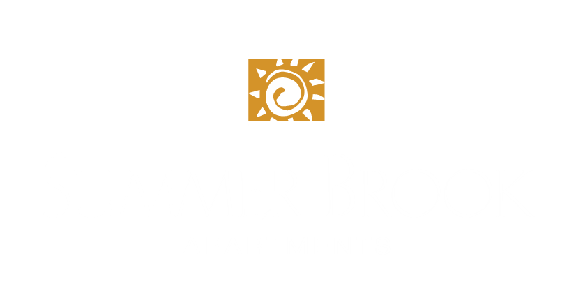 a logo for a company with a sun icon in a rectangle