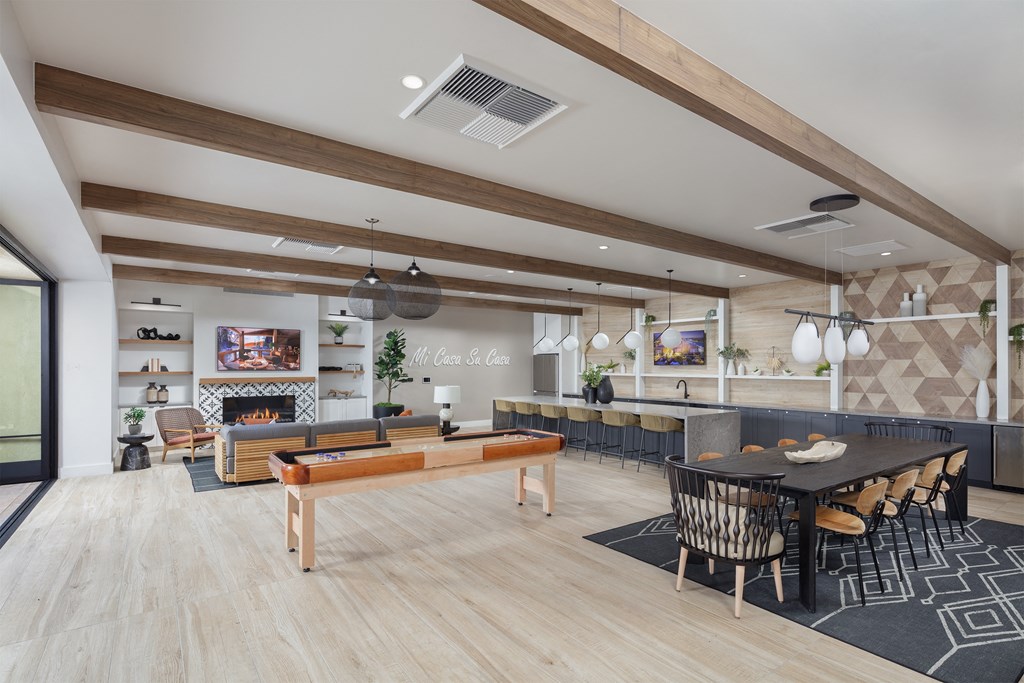 a rendering of the clubhouse with a pool table and dining area