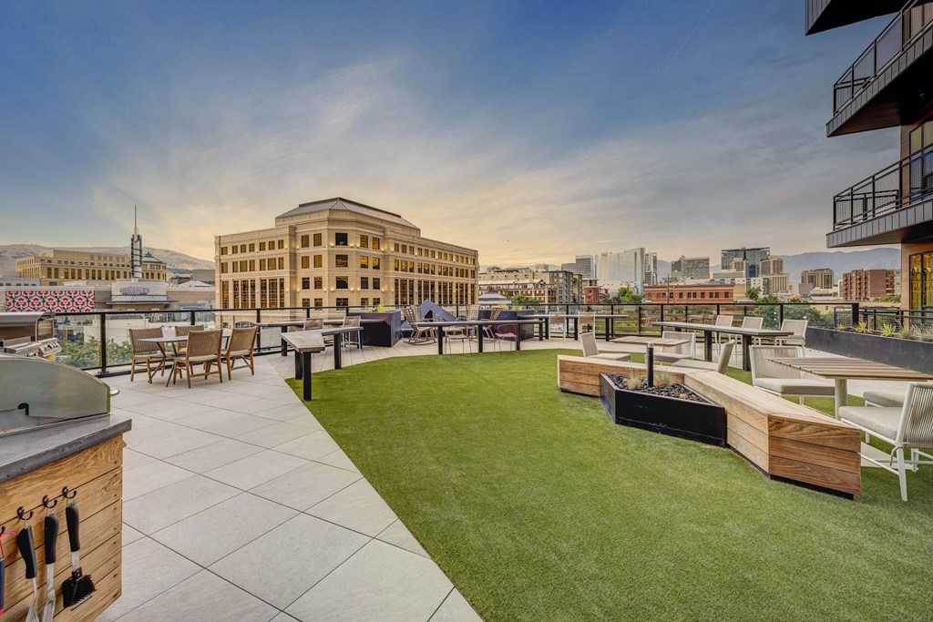 Rooftop BBQ area with stylish seating and city views at Luma new Salt Lake City apartments.