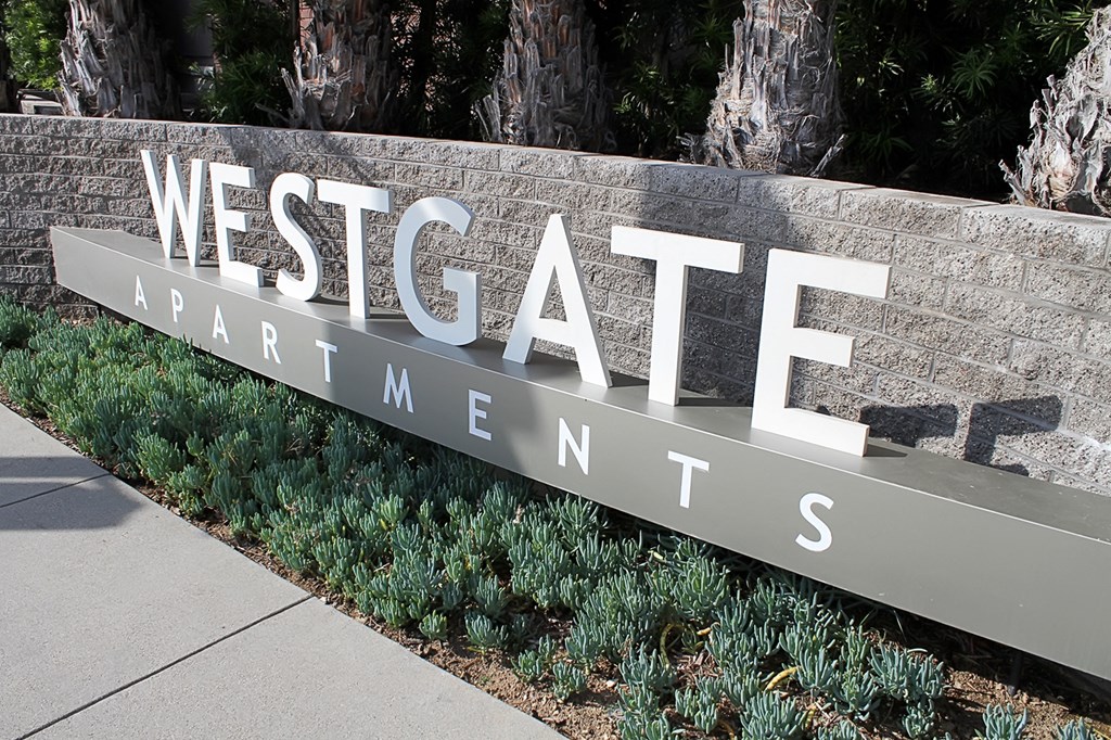 a sign at the entrance to westgate apartments