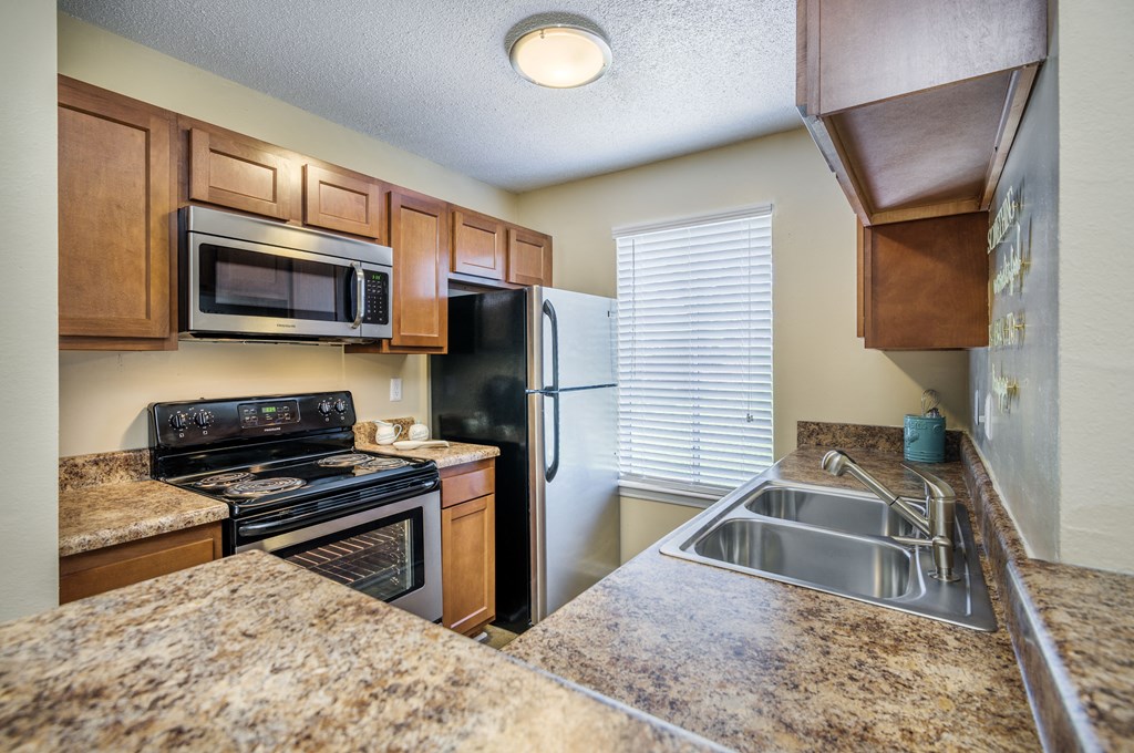 kitchen with granite counter tops and stainless steel appliances