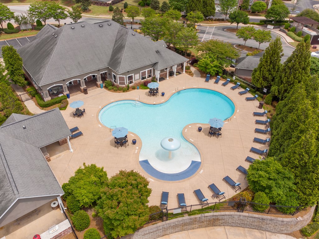 an aerial view of an outdoor swimming pool at a resort